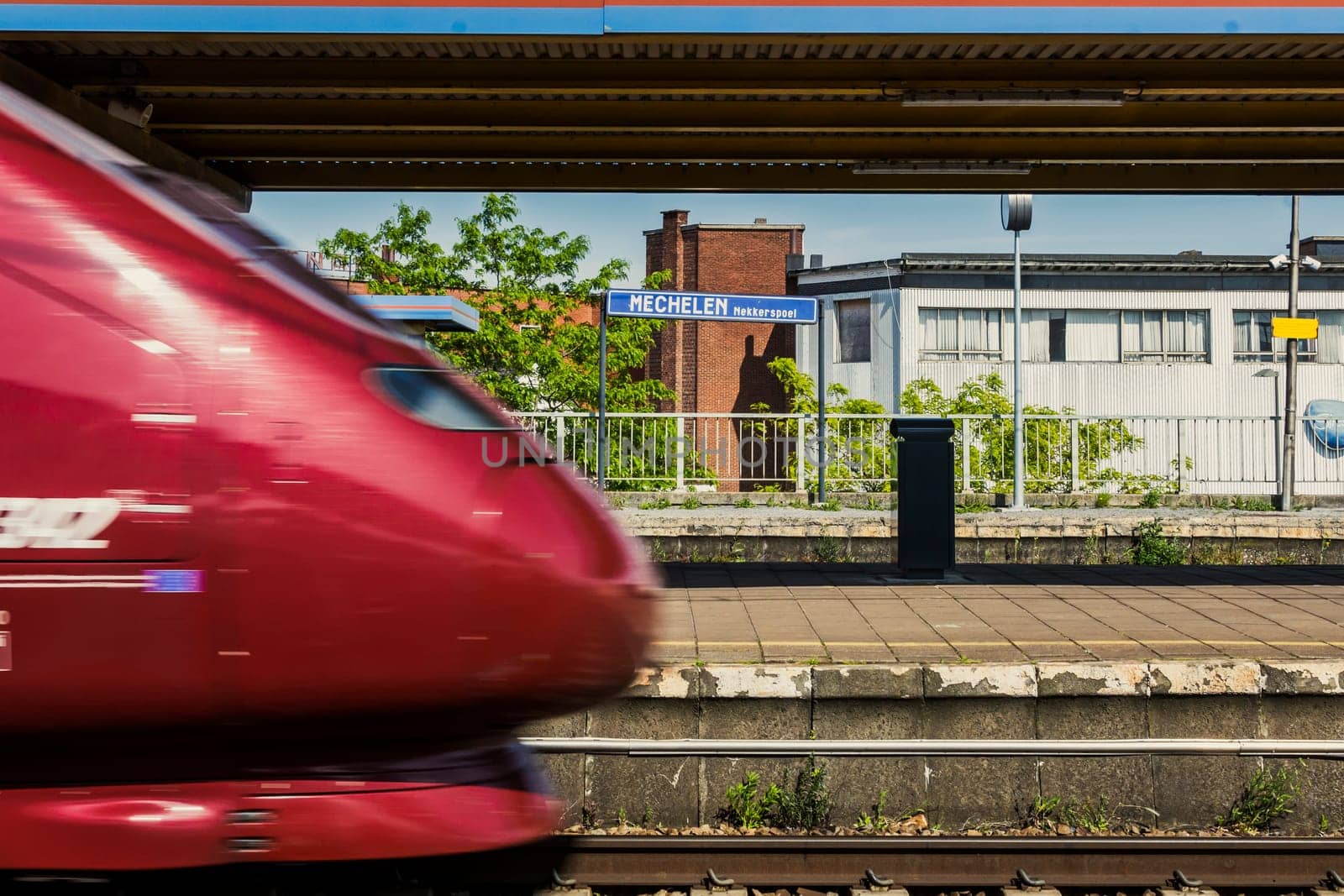 Mechelen, Belgium, May 2023: Train passing by in Mechelen Nekkerspoel train station