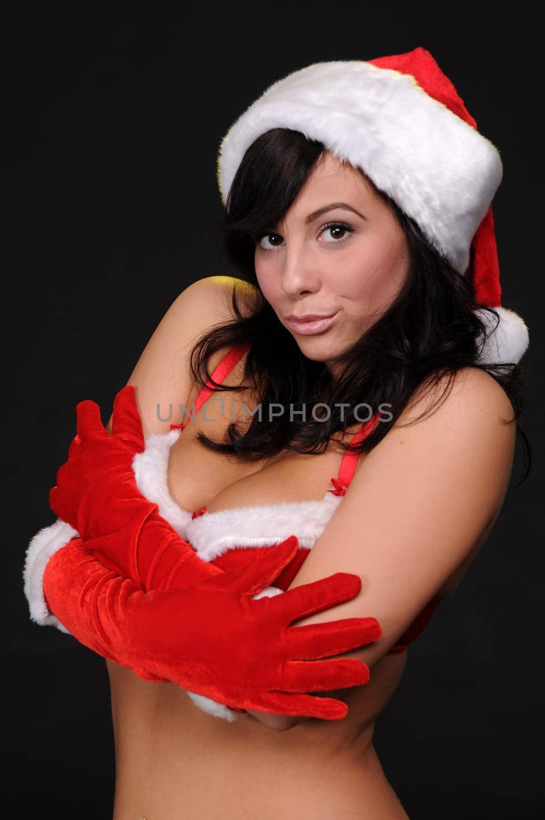 Beautiful brunette in a sexy Santa's helper outfit