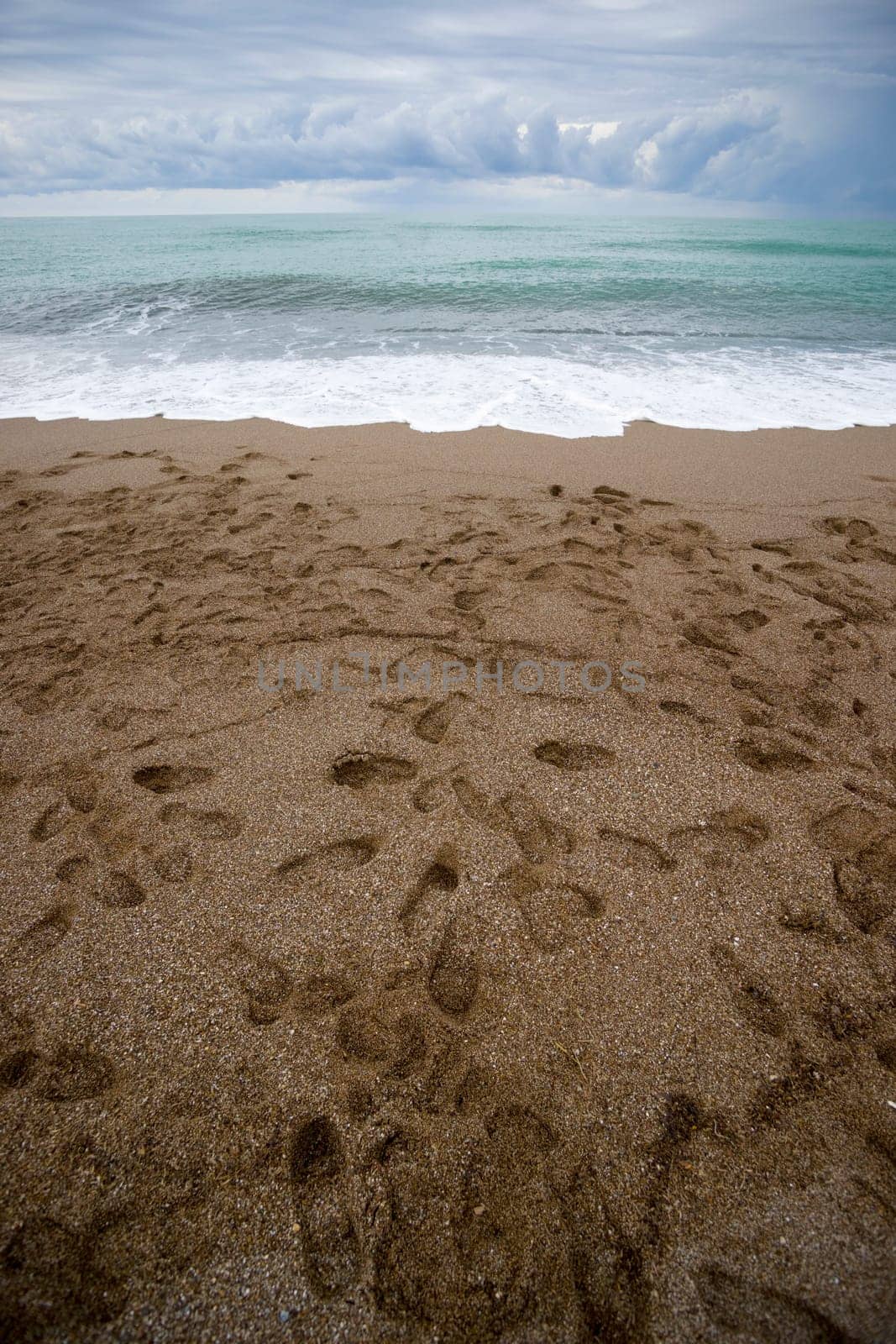 Footsteps on the beach. The Mediterranean Sea, Turkey. aRGB.