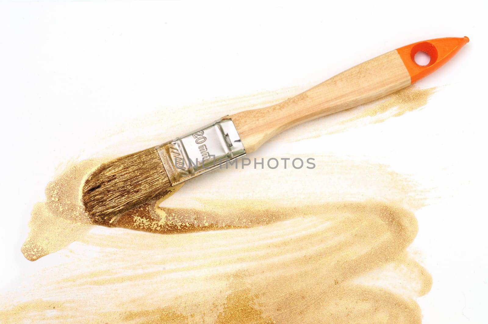 Golden drawdown and paintbrush on the white background