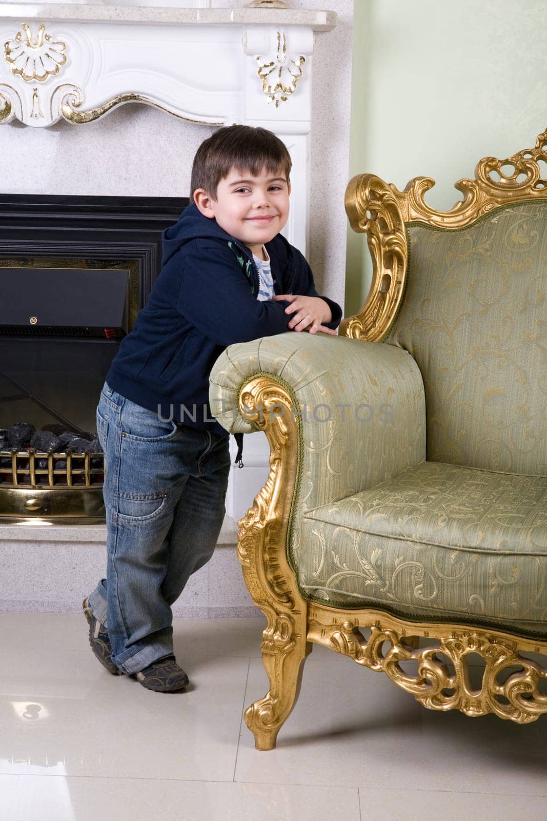 boy near the old armchair