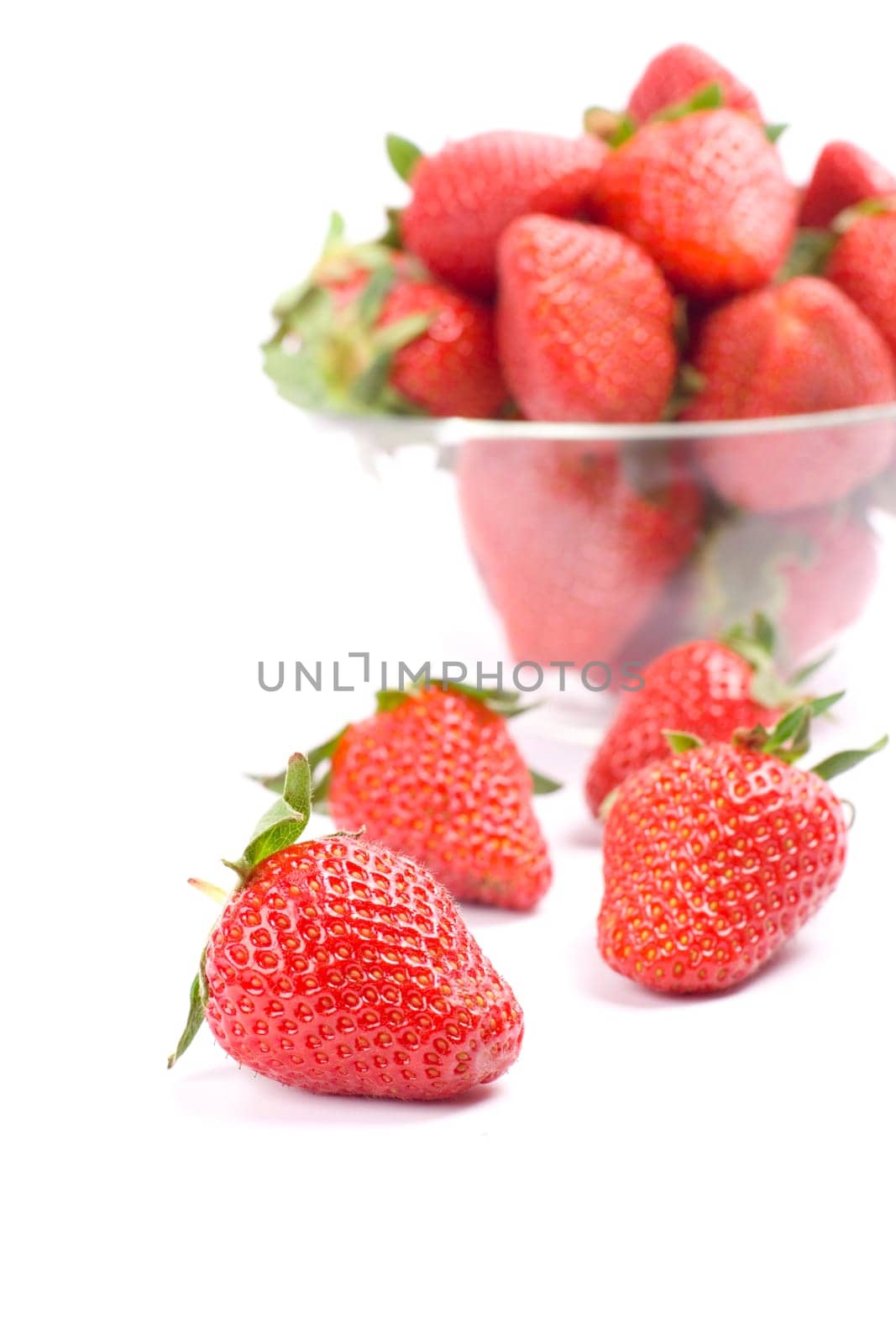 strawberries in the bowl closeup on white background