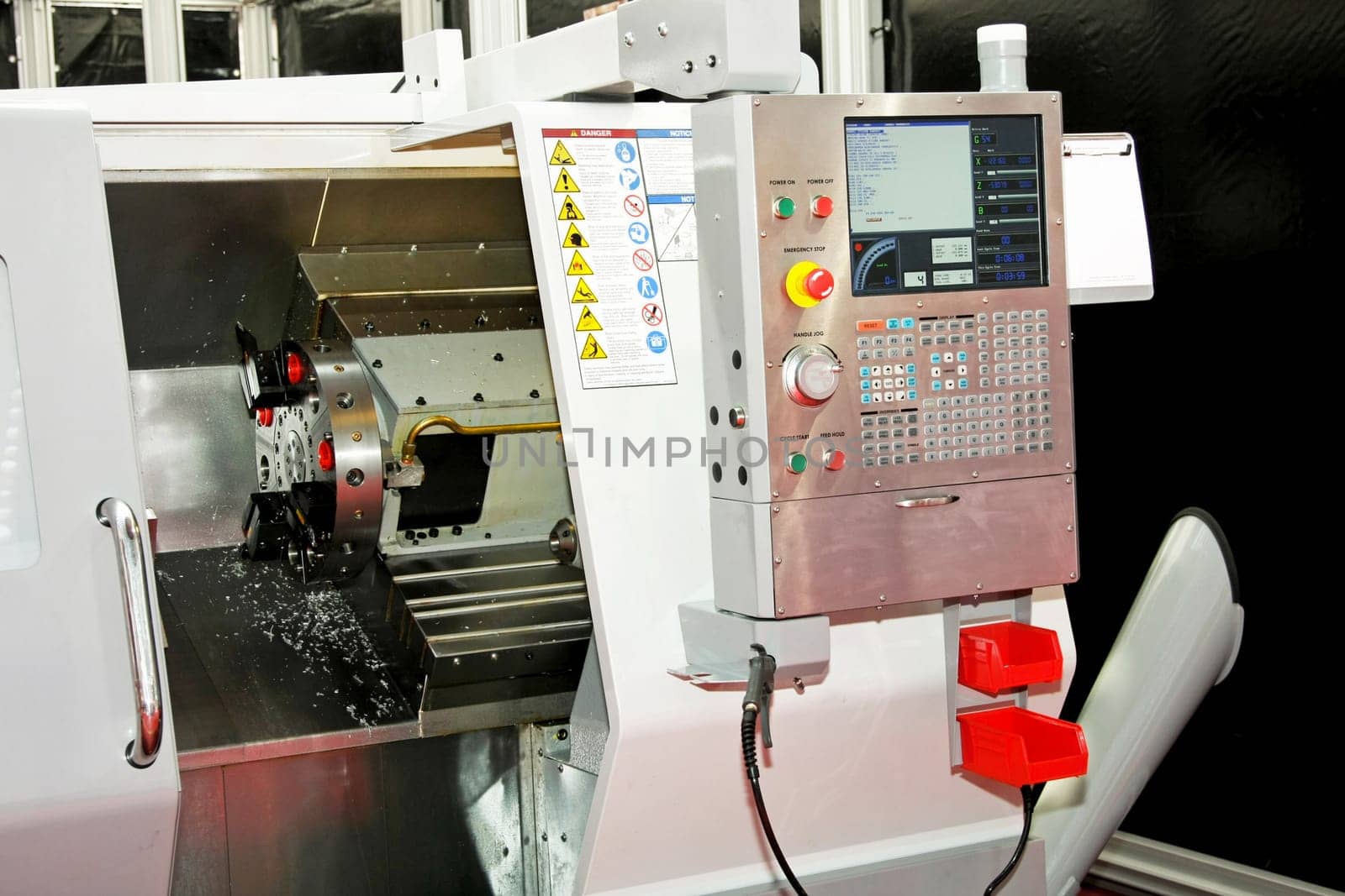 Close up shot of automatic lathe machinery
