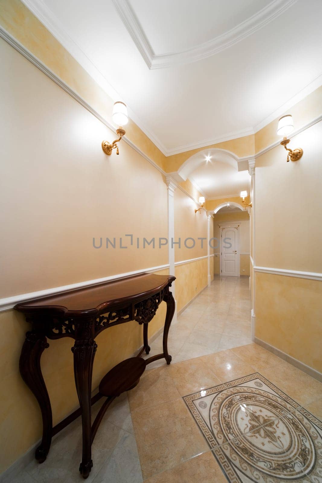Beautiful table in a light corridor with a door