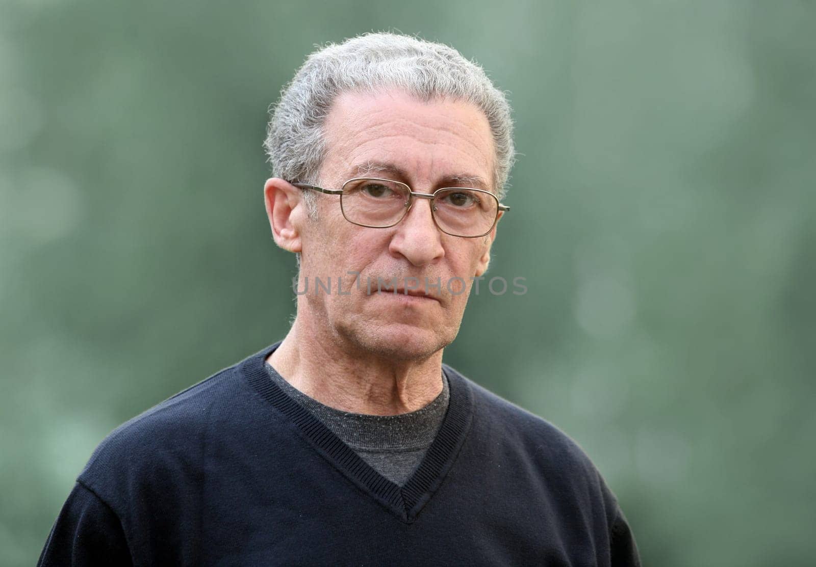 A portrait of a serious senior man