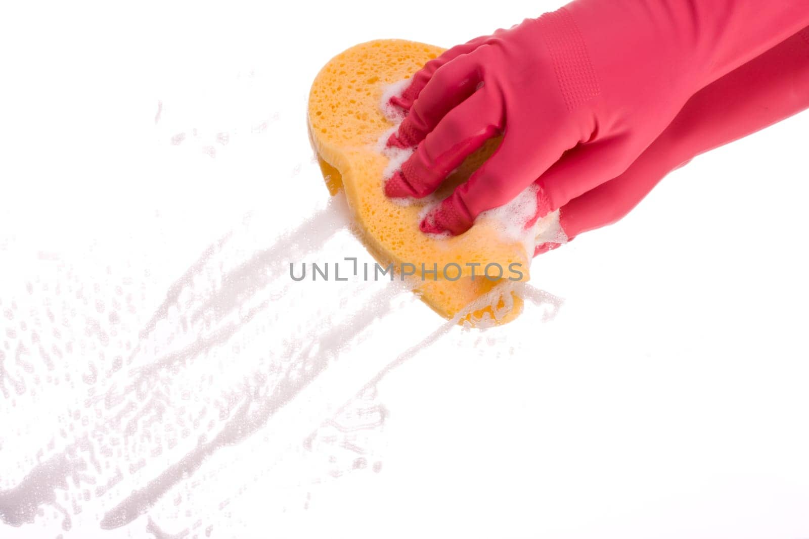 pink hand cleaning a mirror