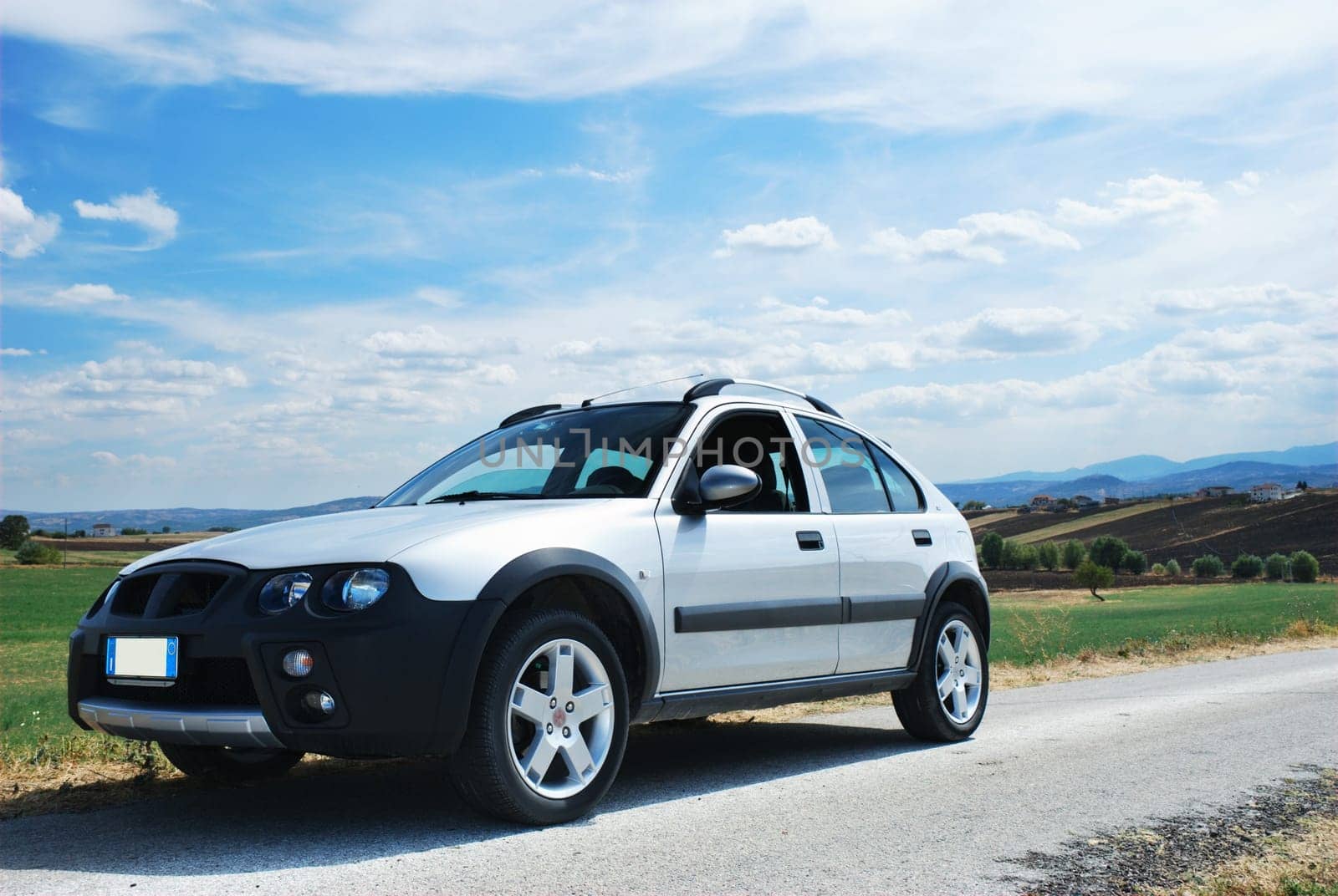 Modern car at the side of a rural road