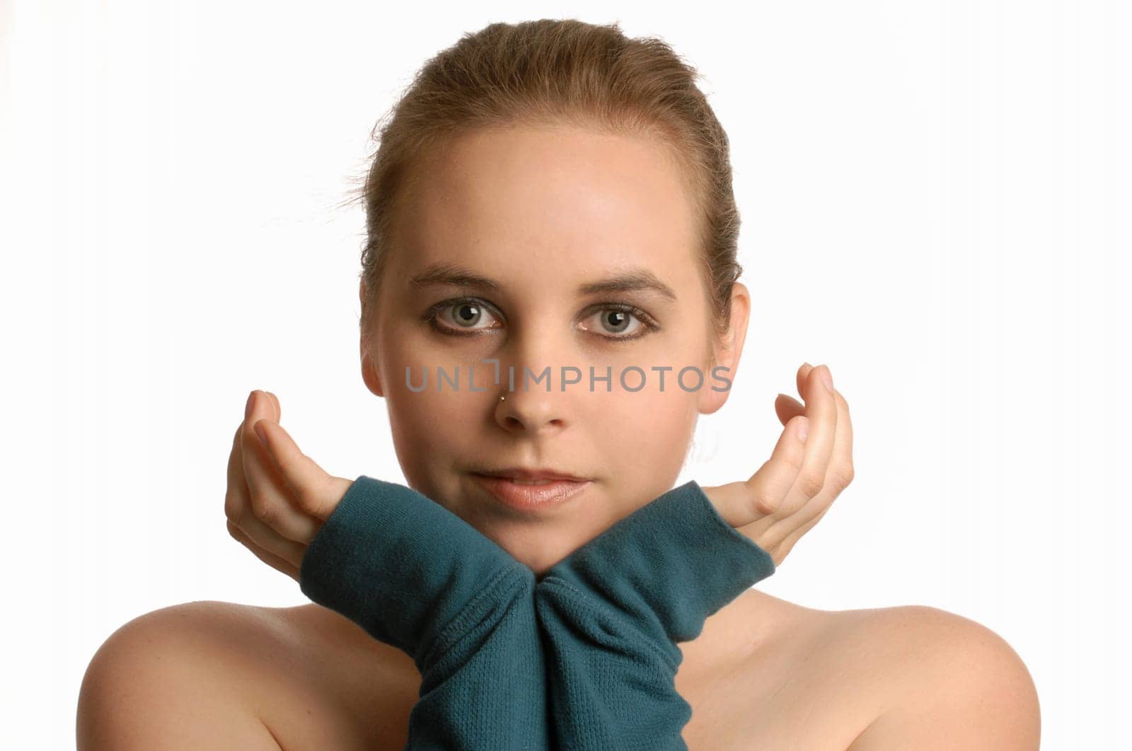 beautiful young woman with hand up framing face on white background