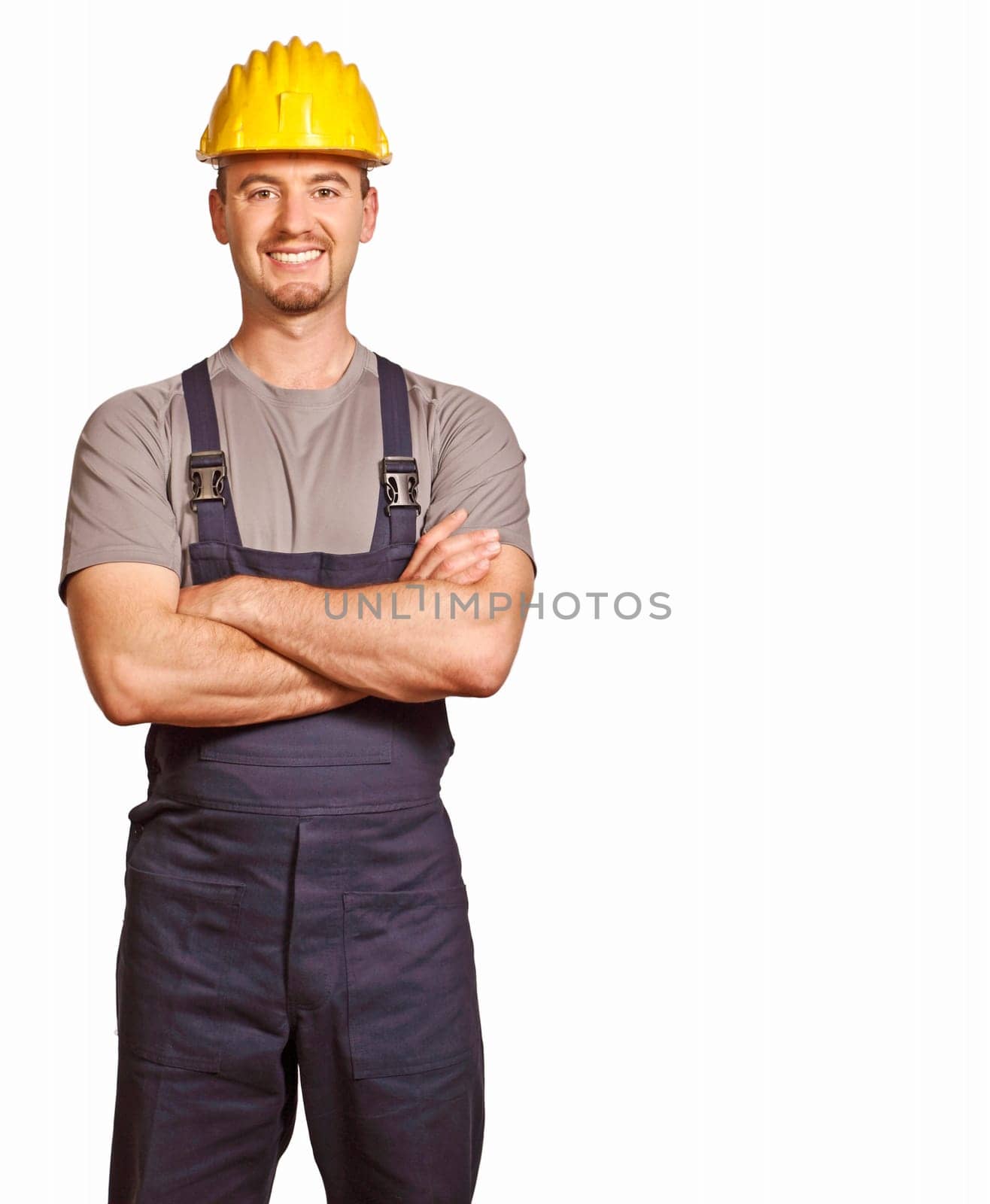 fine portrait of young caucasian handyman isolated on white