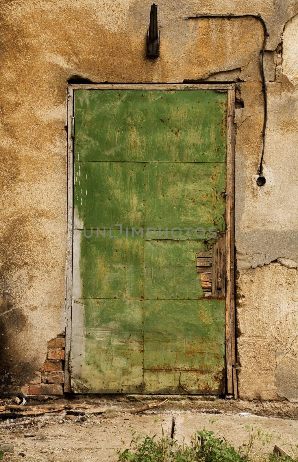 Old green wooden grungy door