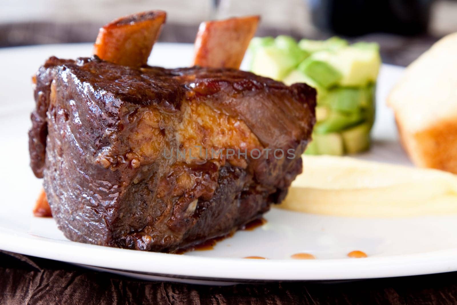 Short rib, cooked to perfection, served with savoury pound cake, avocado cubes, turnip puree and county cider reduction.