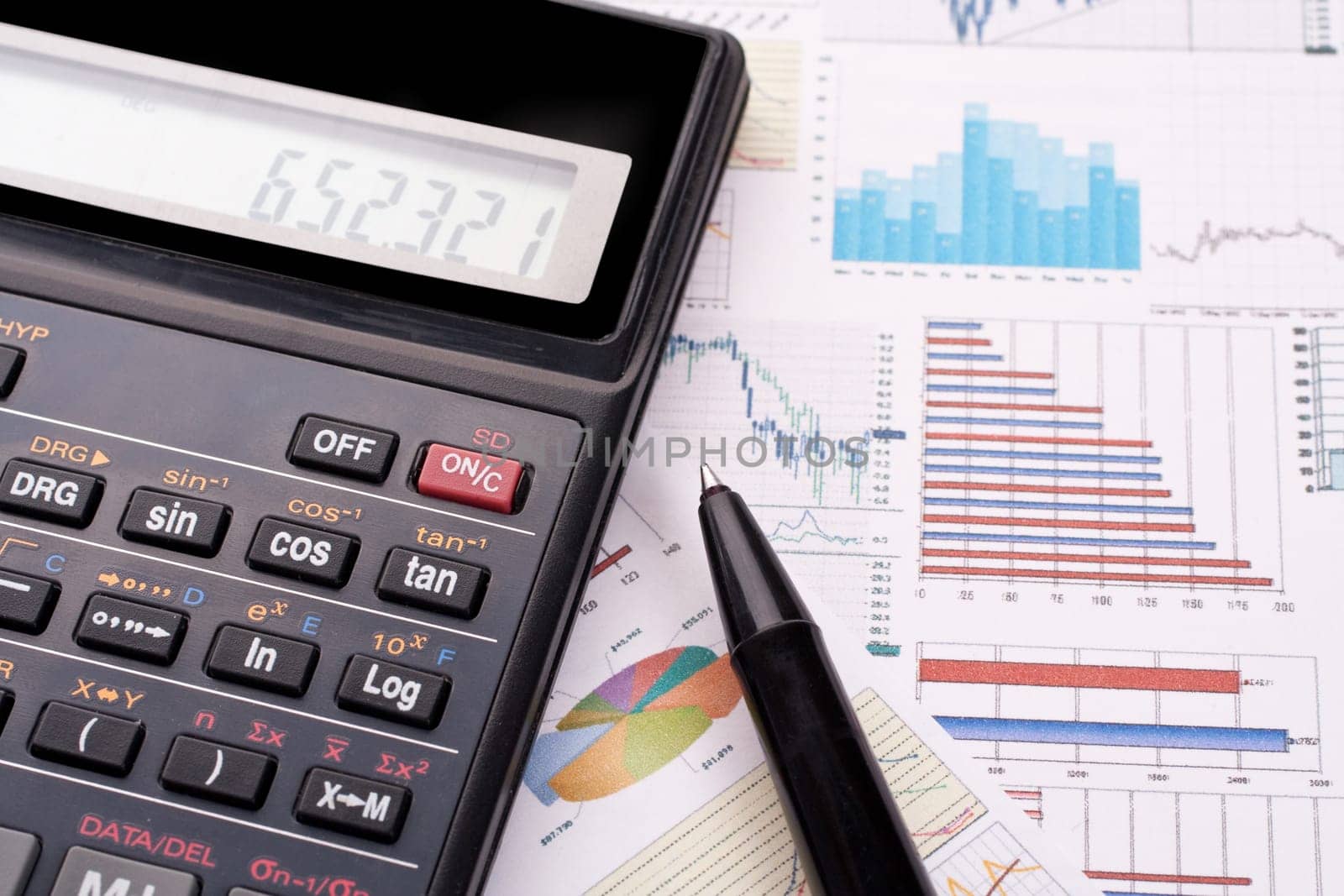 financial statement with calculator and pen