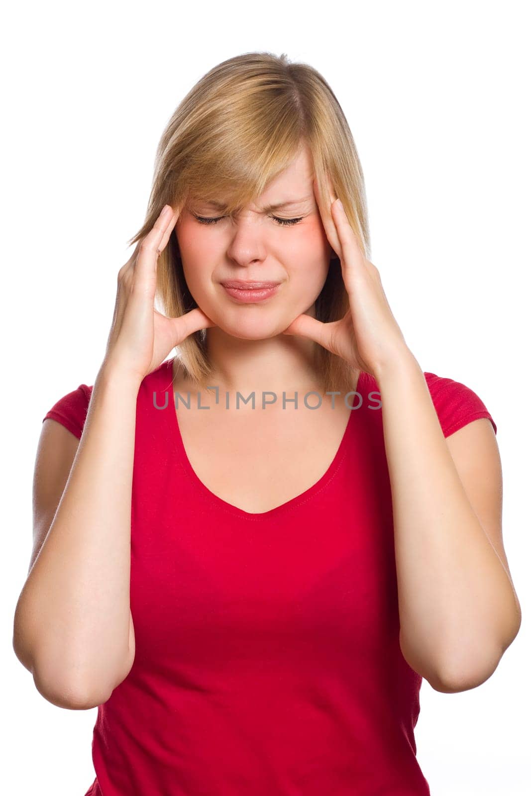 beautiful blonde female in red shirt is having a headache isolated on white