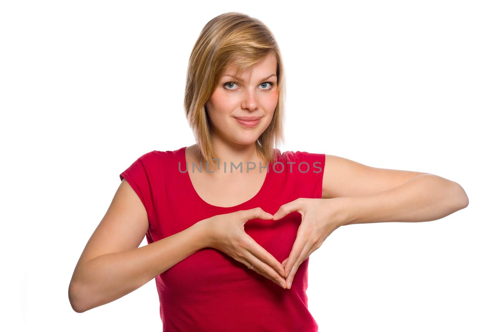 form of heart shaped by the hands of a beautiful young women