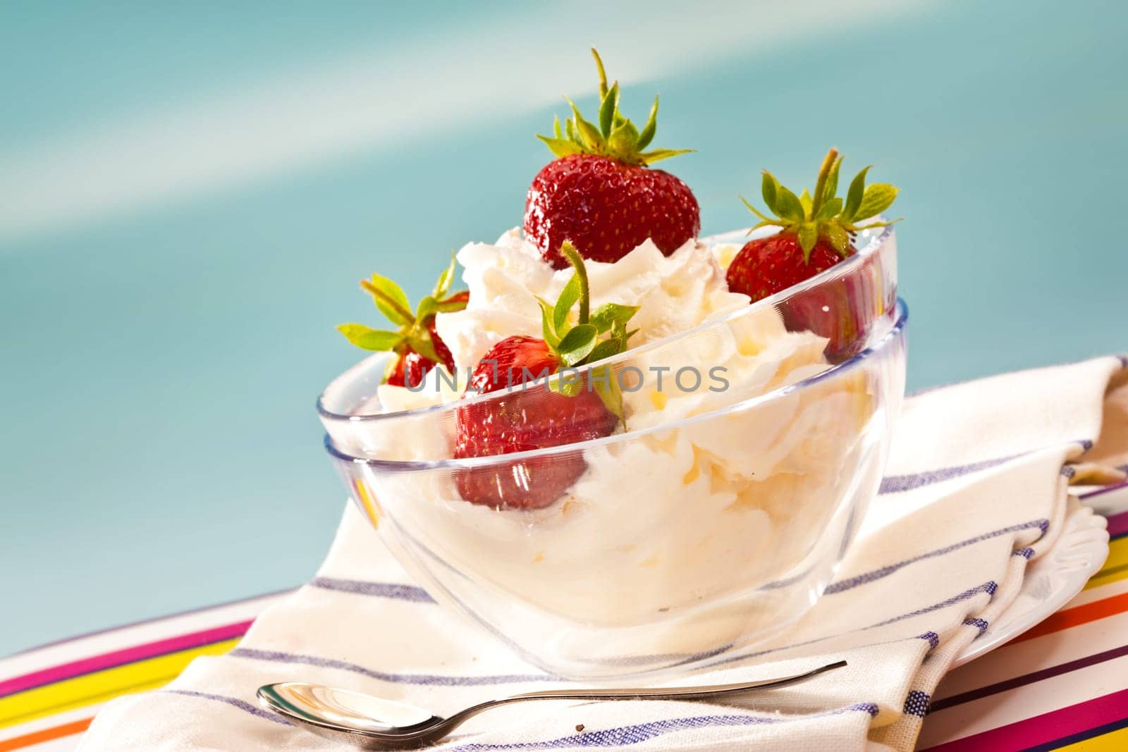food series: strawberry with whipped cream in glassy bowl