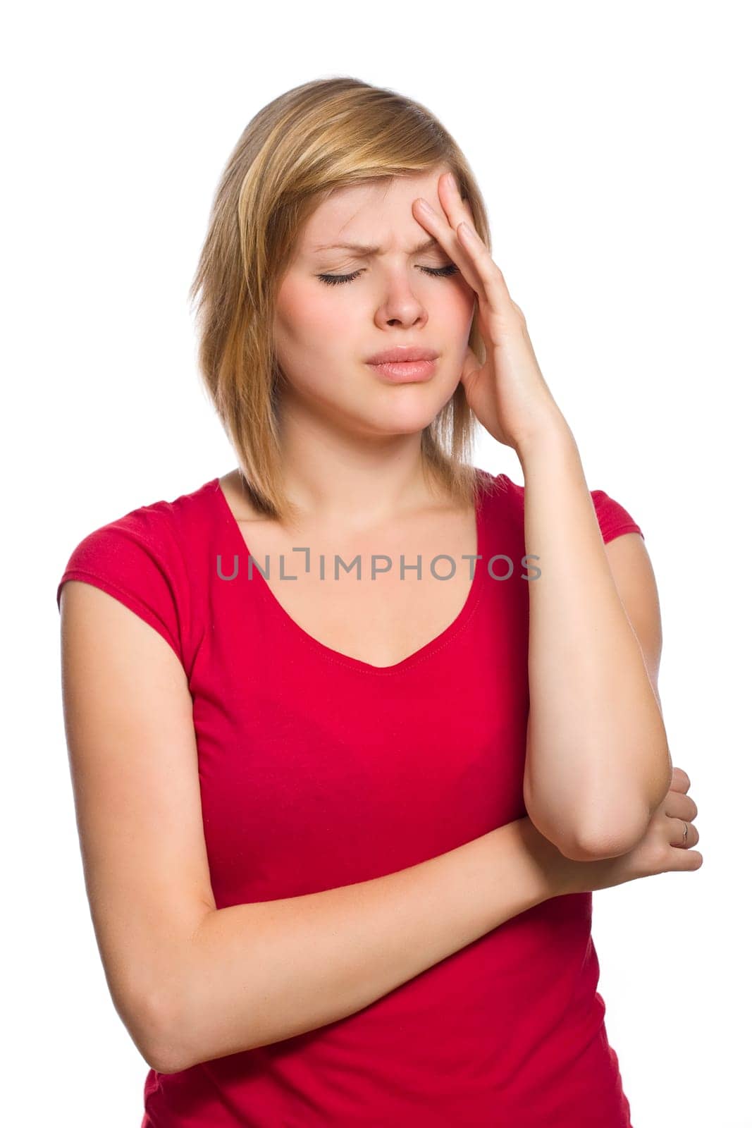 beautiful blonde female in red shirt is having a headache isolated on white