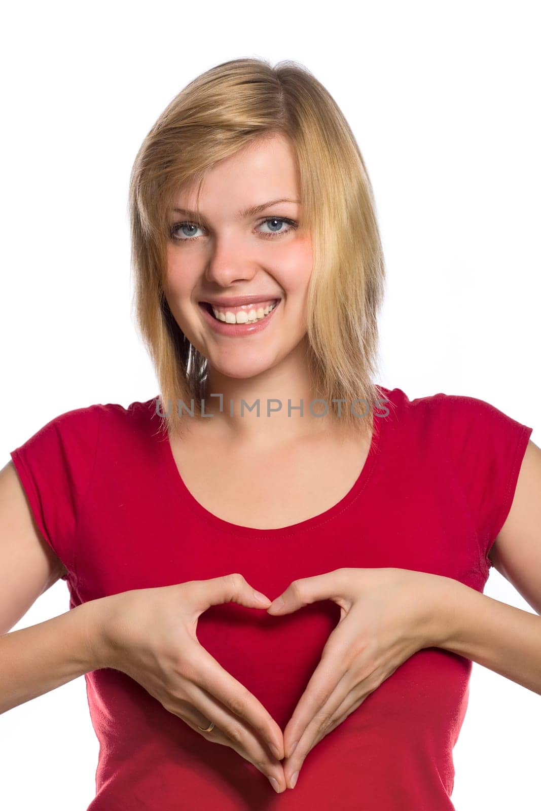 form of heart shaped by the hands of a beautiful young women