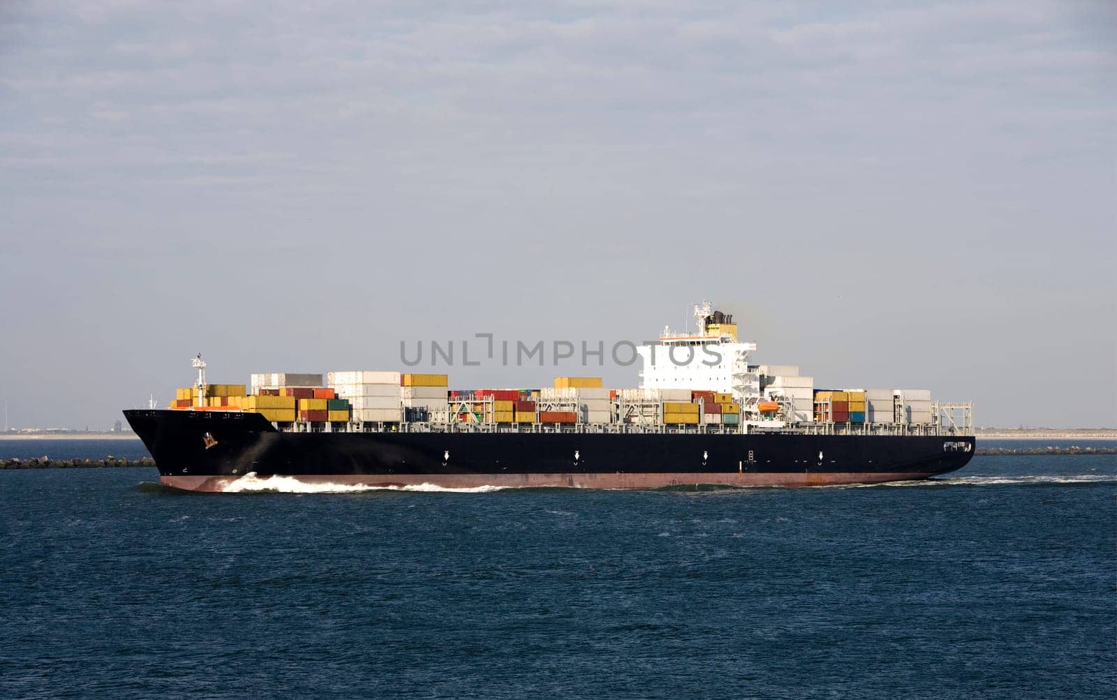 Container ship is leaving the Port of Rotterdam