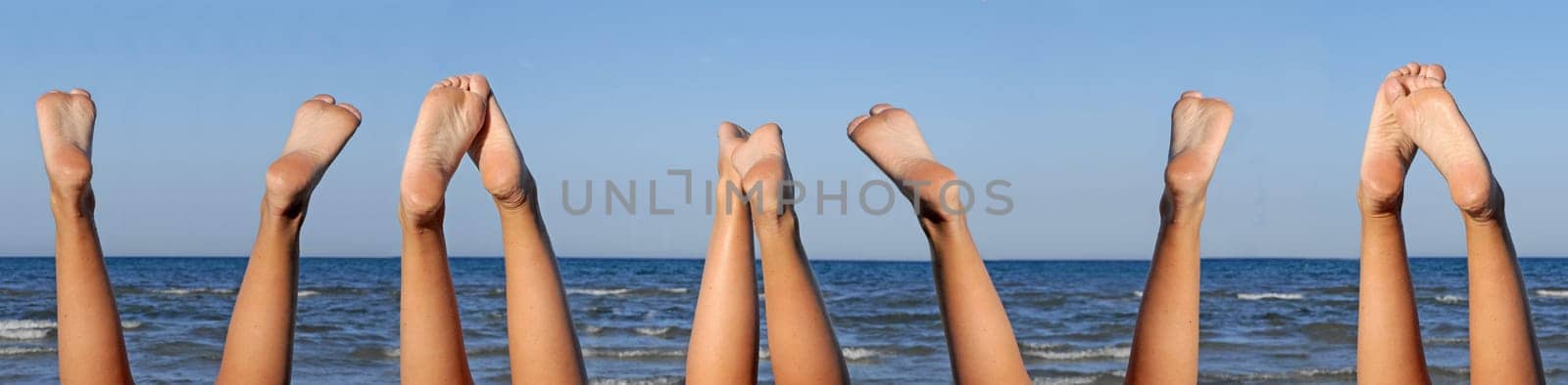 lovely legs on the beach on blue sky