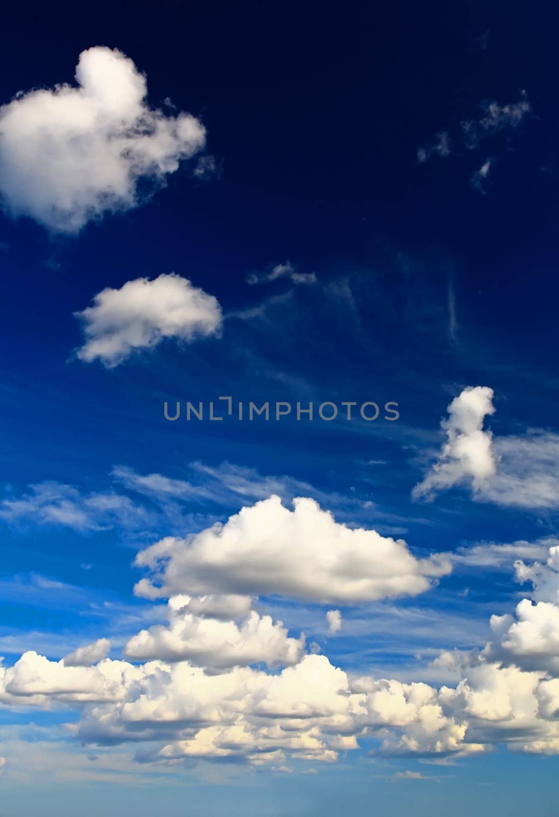 White clouds over blue sky - a great background image for many uses