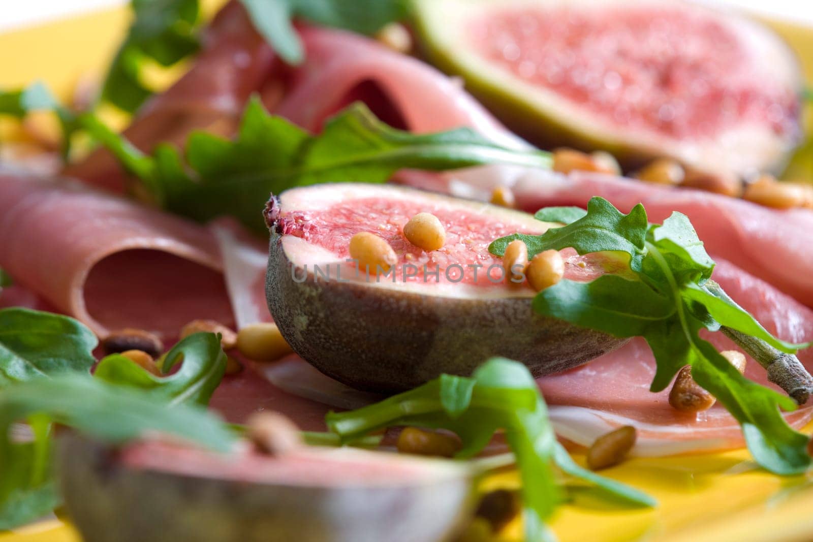 Spanish ham with figs and pine nuts