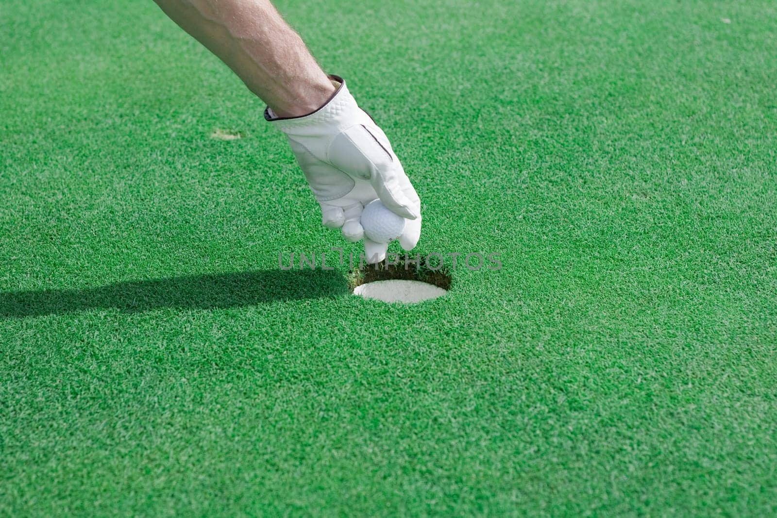 Take a golf ball out of a hole