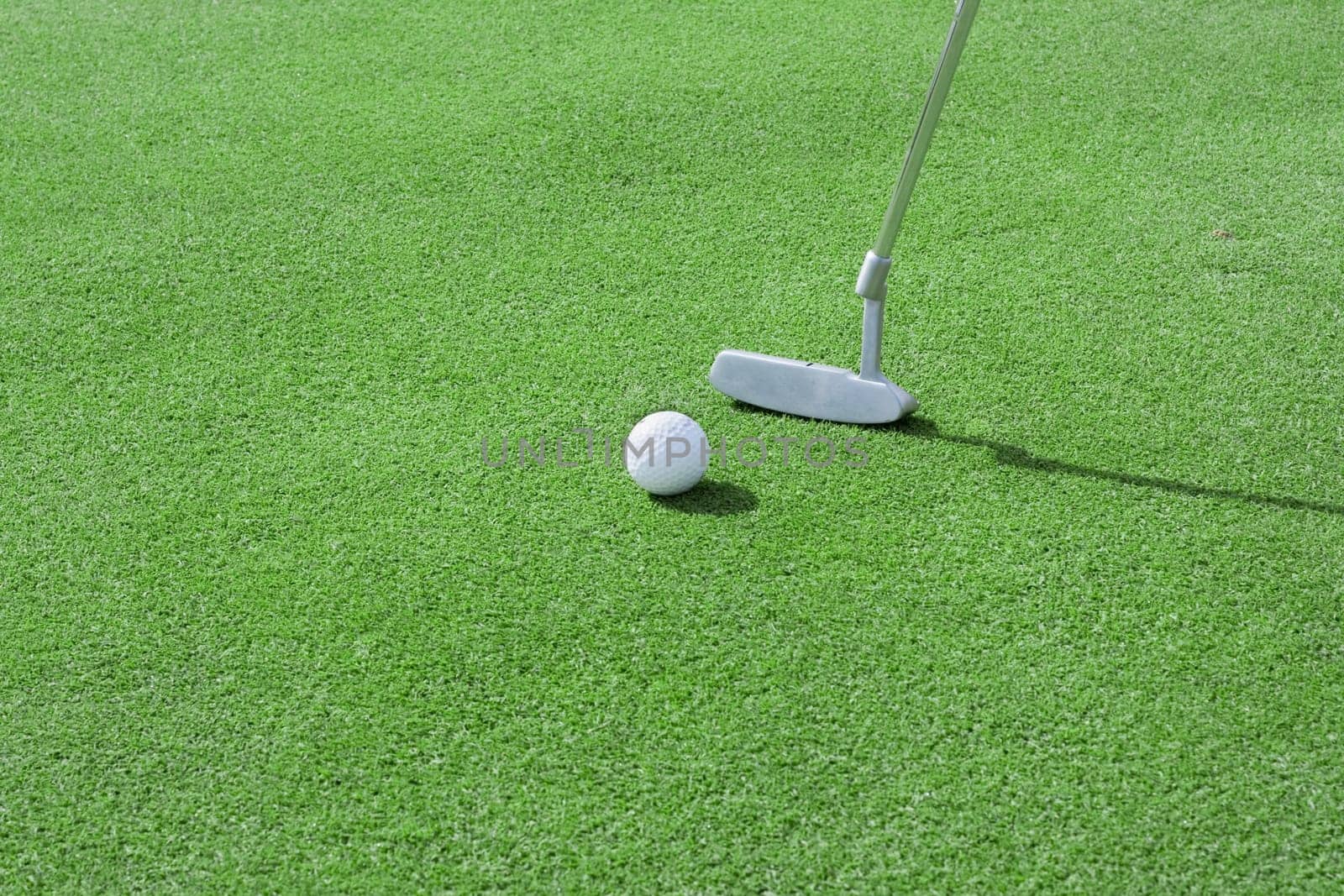 Putting a golf ball on the greens