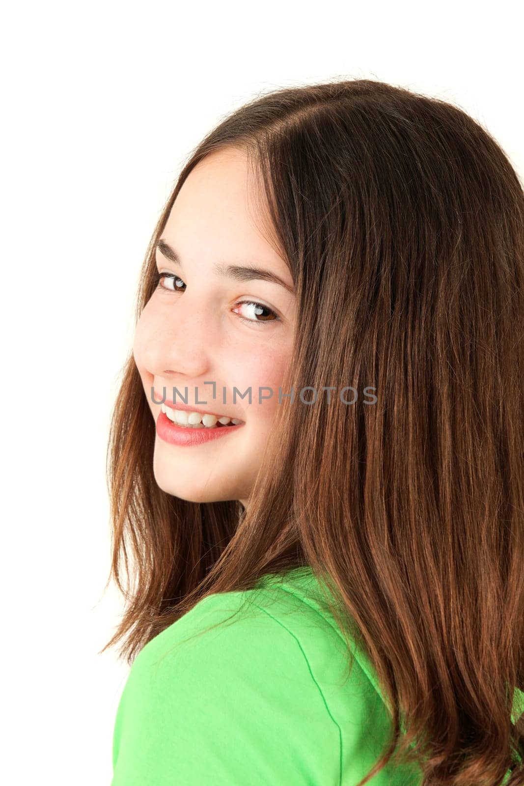 Portrait of young smiling teenage girl, studio shot