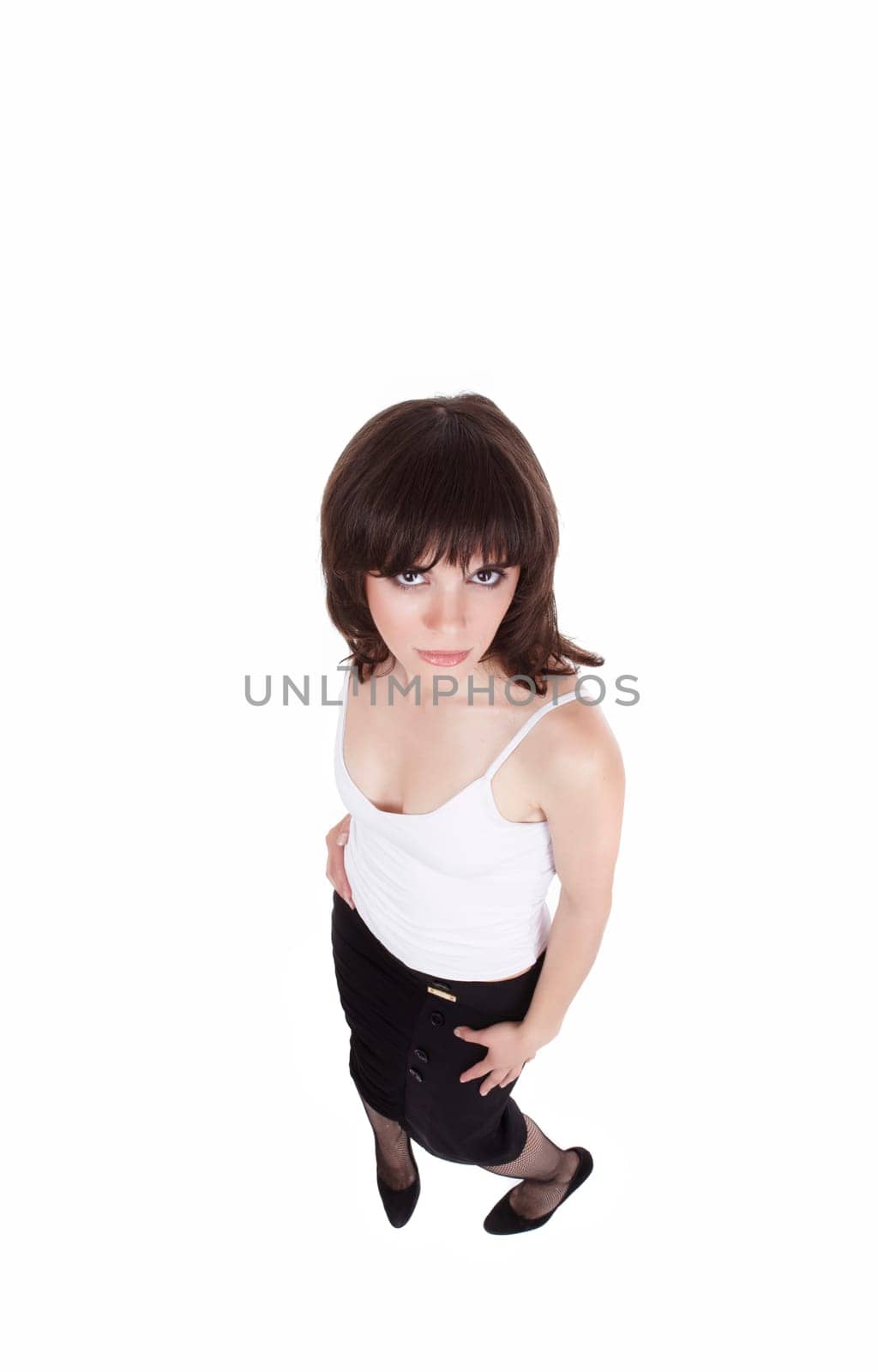 The beautiful sexual girl in a white vest and a black skirt on a white background (top view)