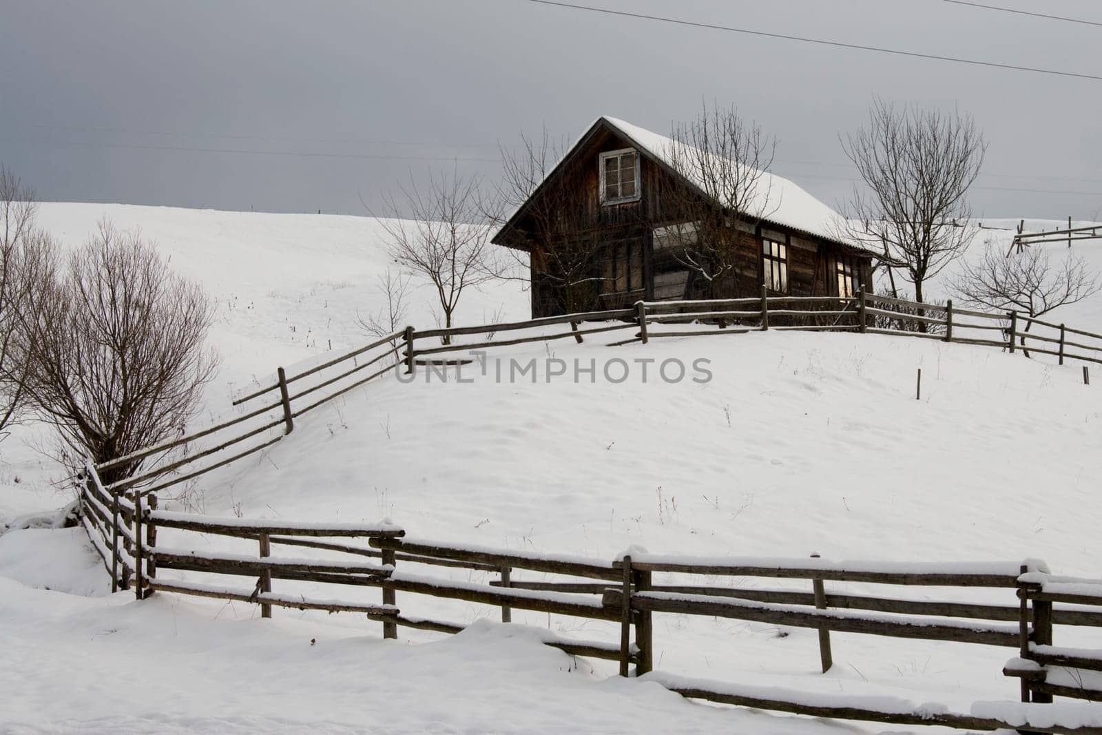 Cottage on the hill with lots of snow.
