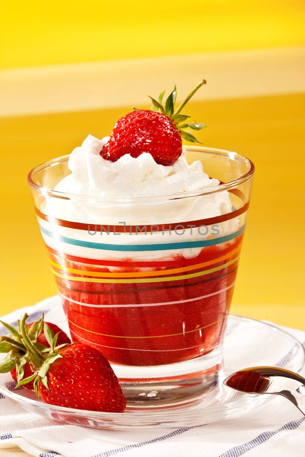 food series: strawberry with whipped cream in glassy bowl