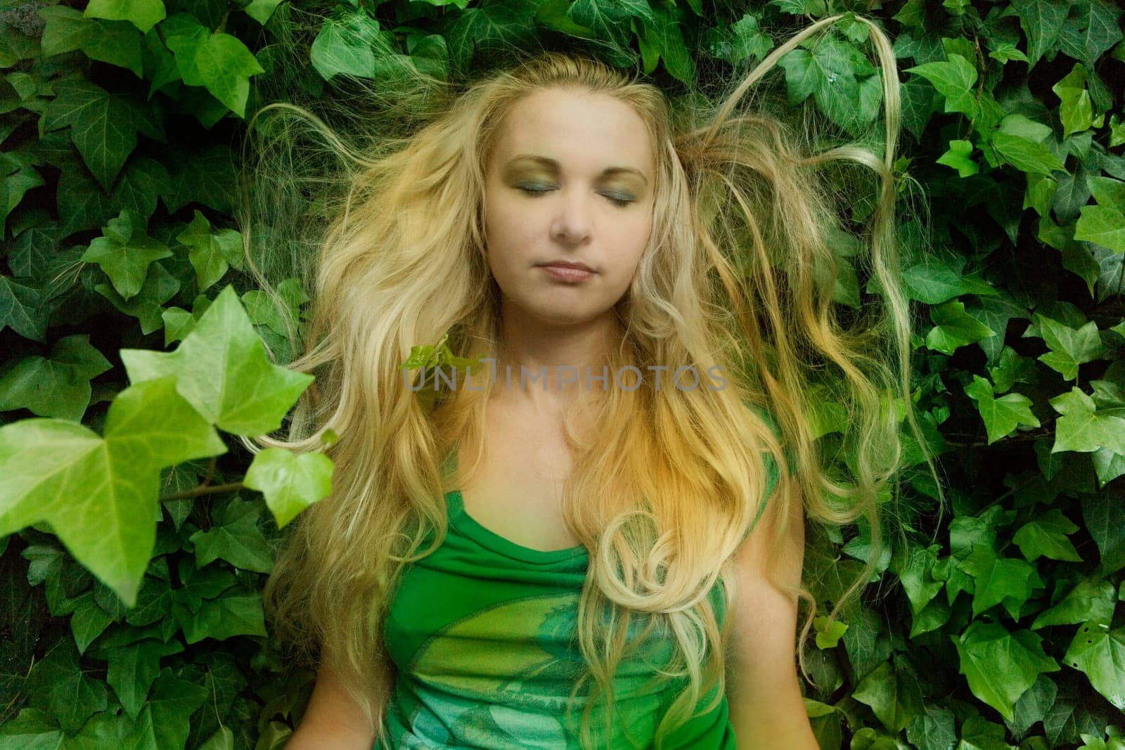 blonde sleeping in leaves