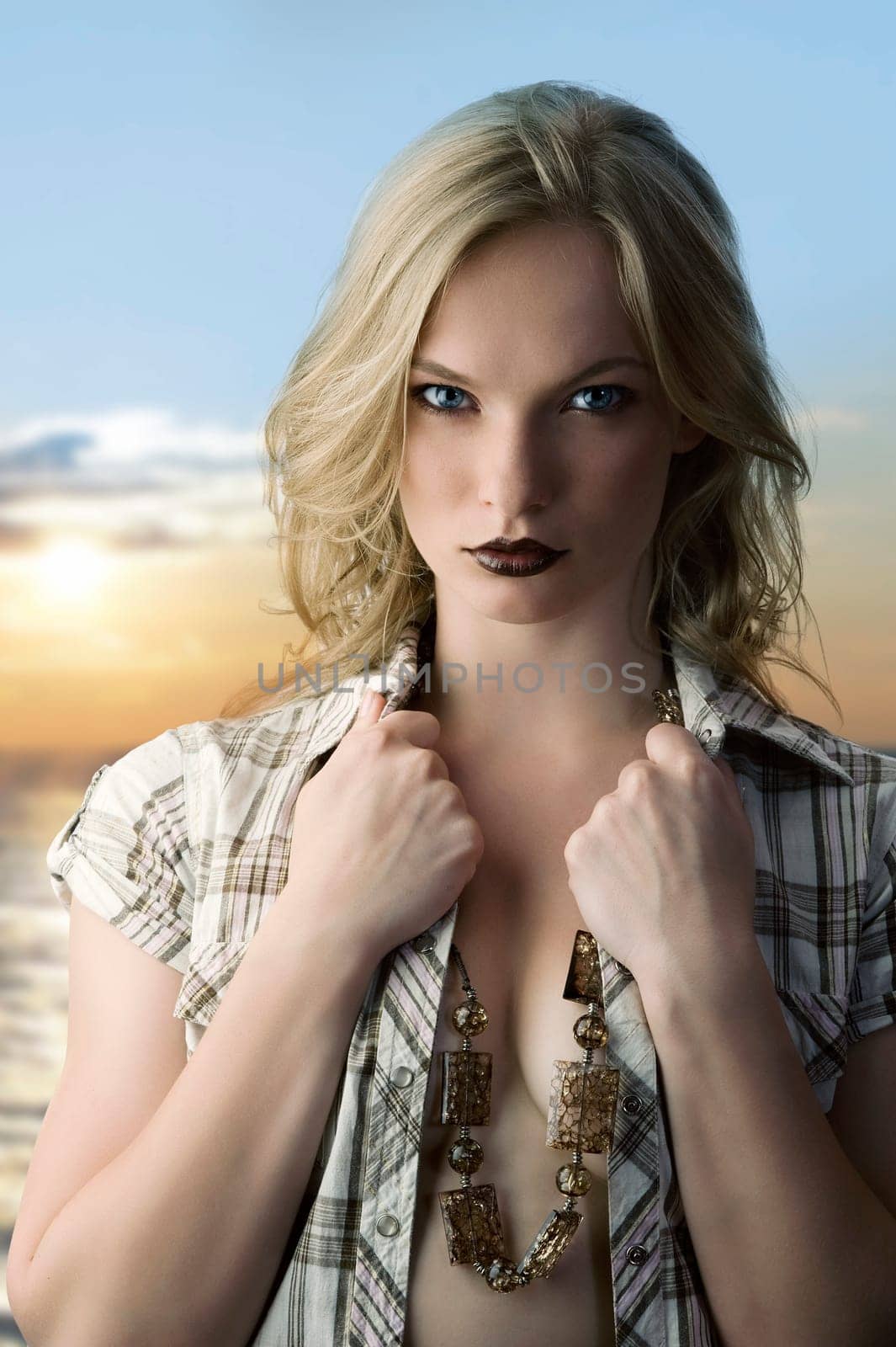 sensual portrait of pretty young blond with open shirt and dark lips