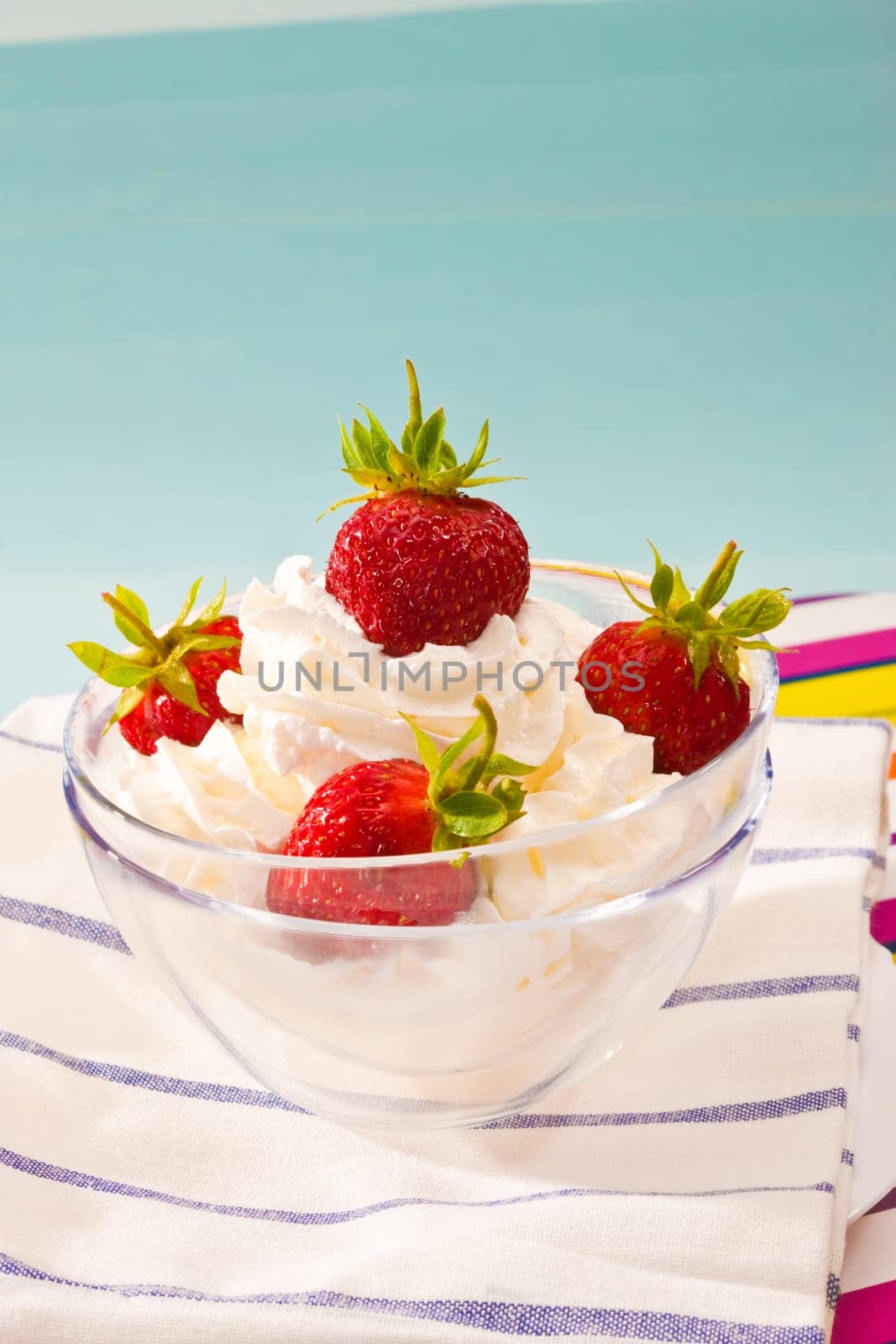 food series: strawberry with whipped cream in glassy bowl