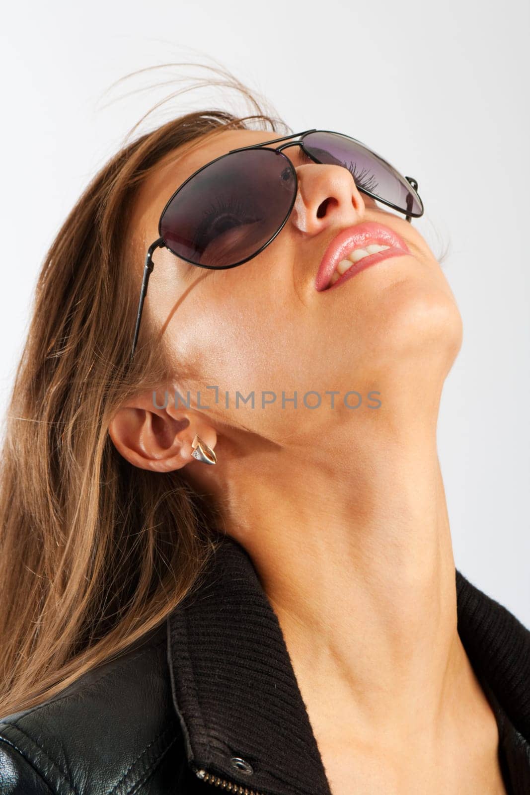 Girl in sunglasses looking up