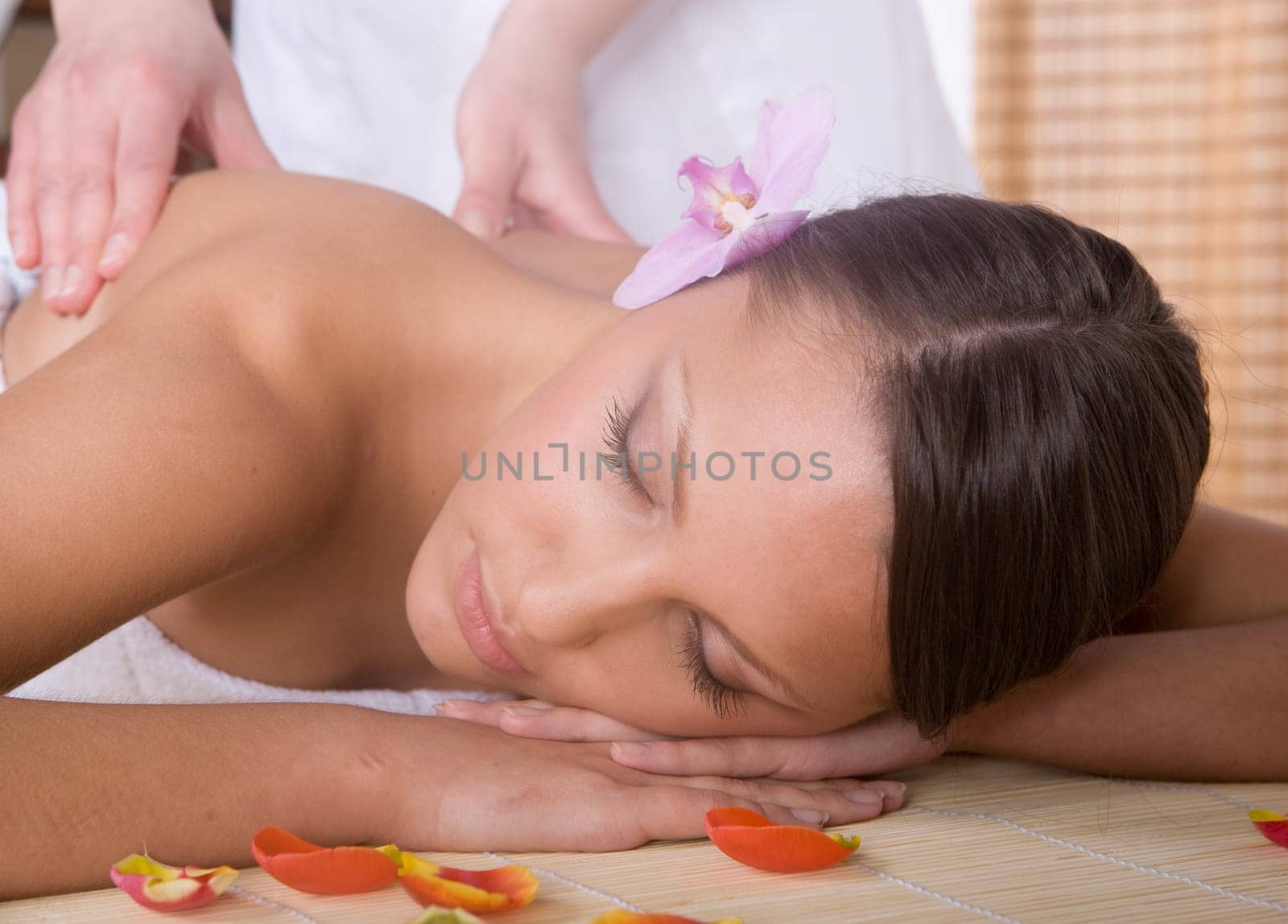 young woman relaxing in spa salon