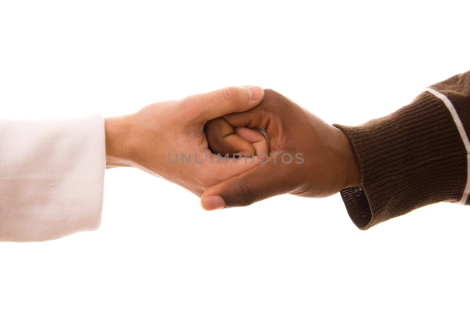 Black and white hands shaking in friendly agreement isolated on white