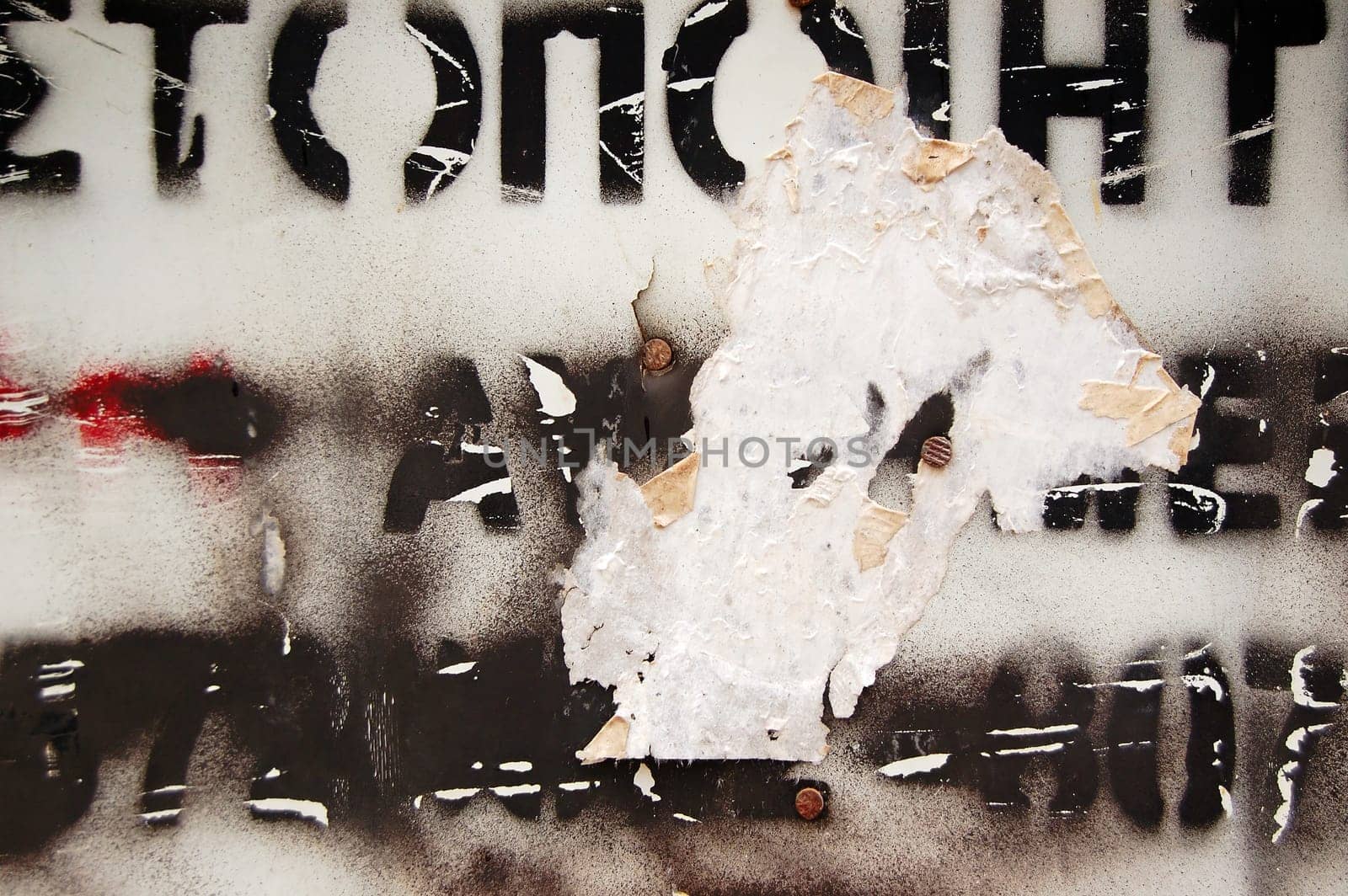 Type stencil on weathered surface. Abstract background texture.