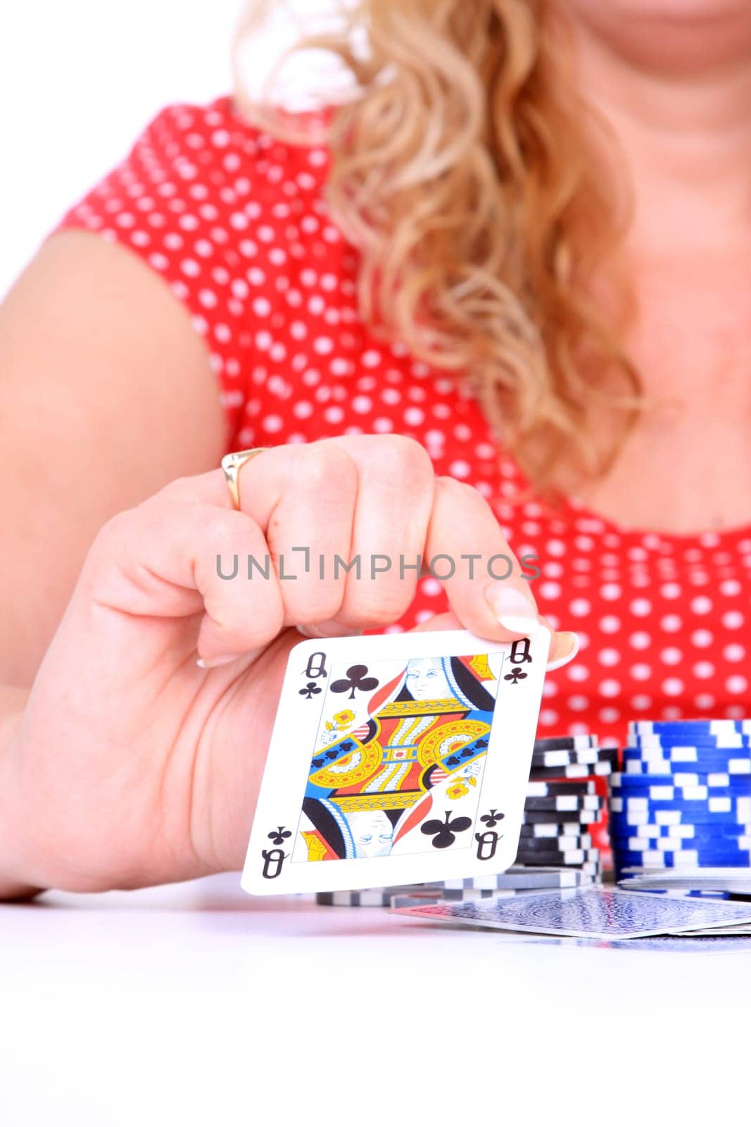 Sexy young woman playing poker