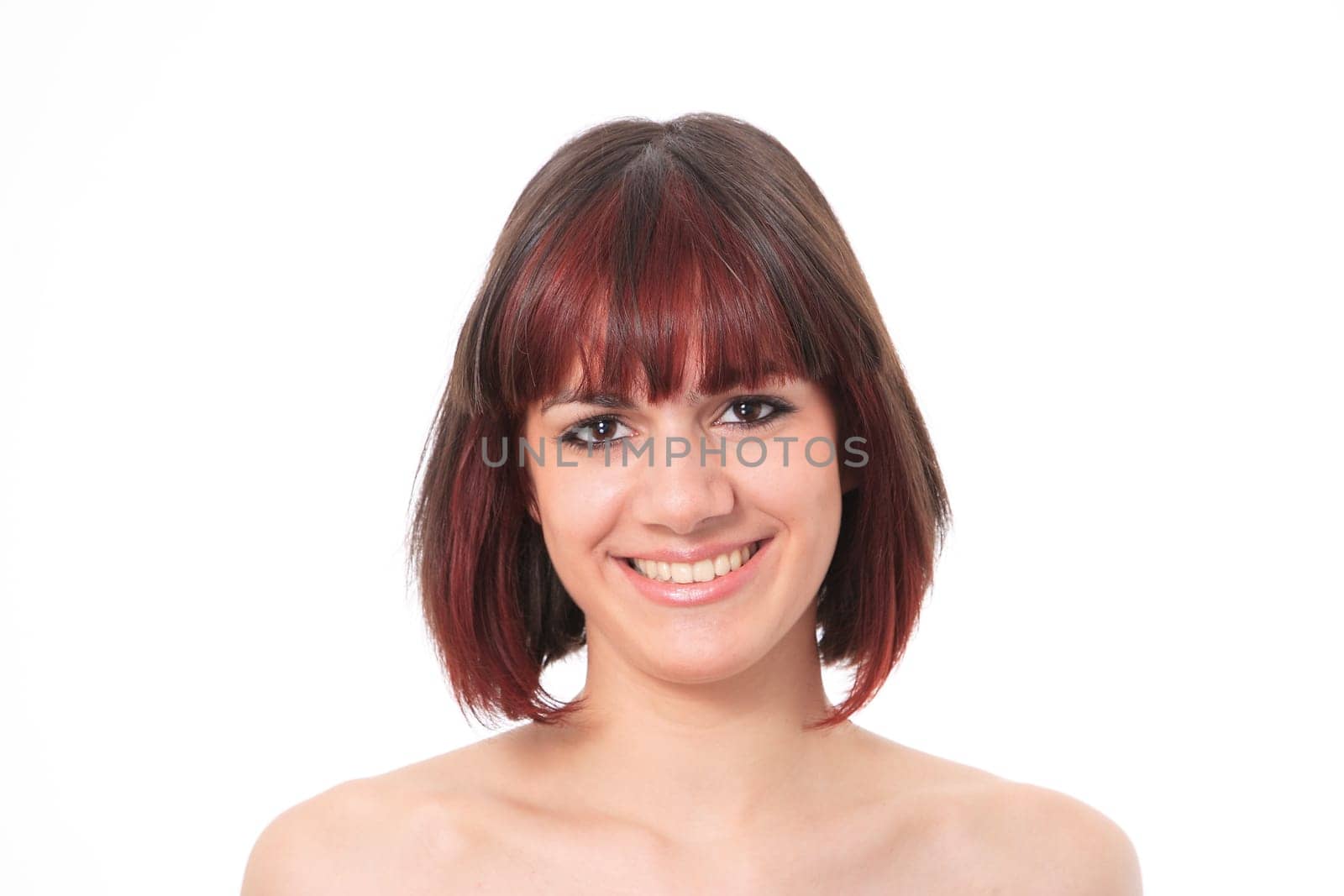 Closeup portrait of a happy young woman smiling isolated on white background