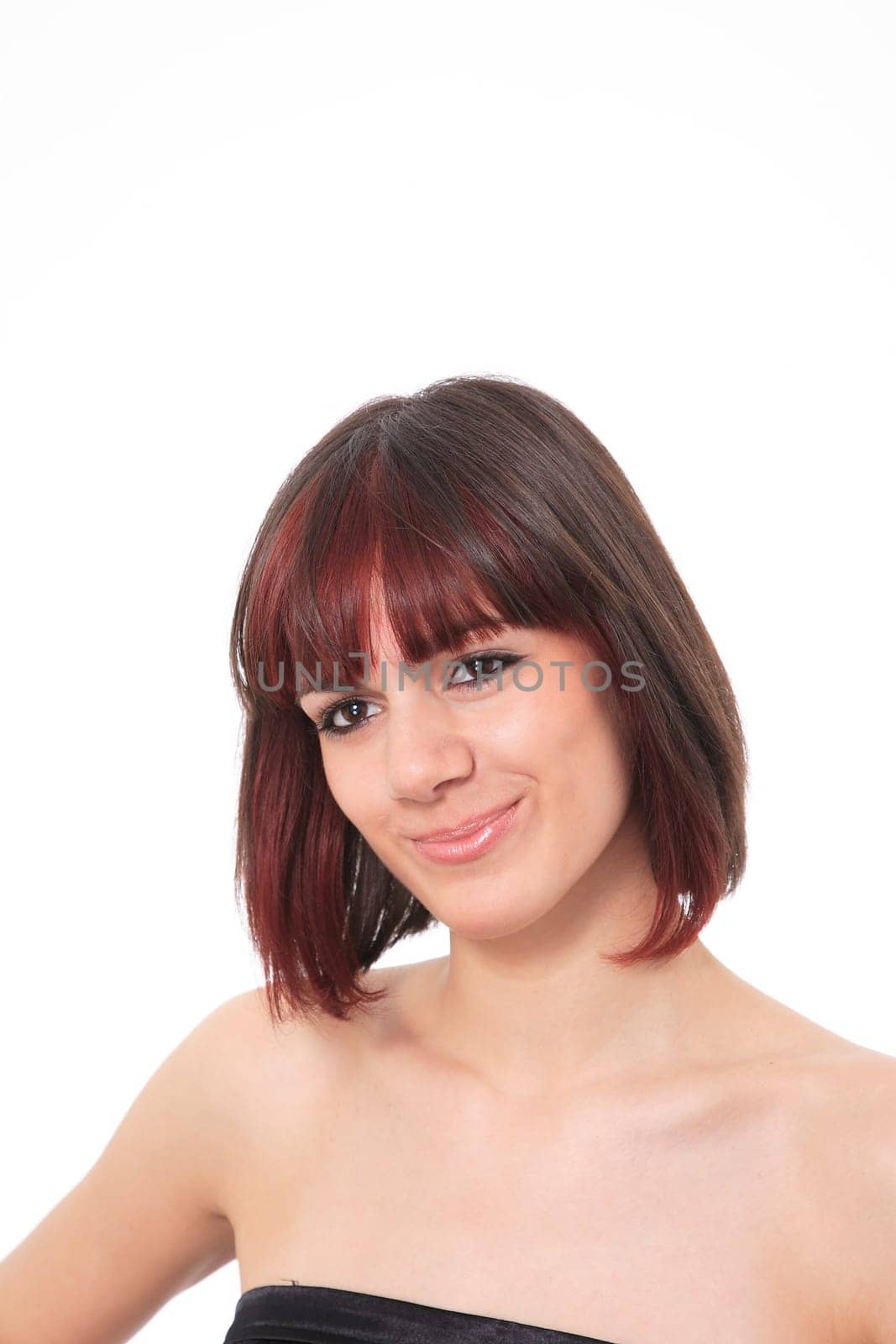 Closeup portrait of a happy young woman smiling isolated on white background
