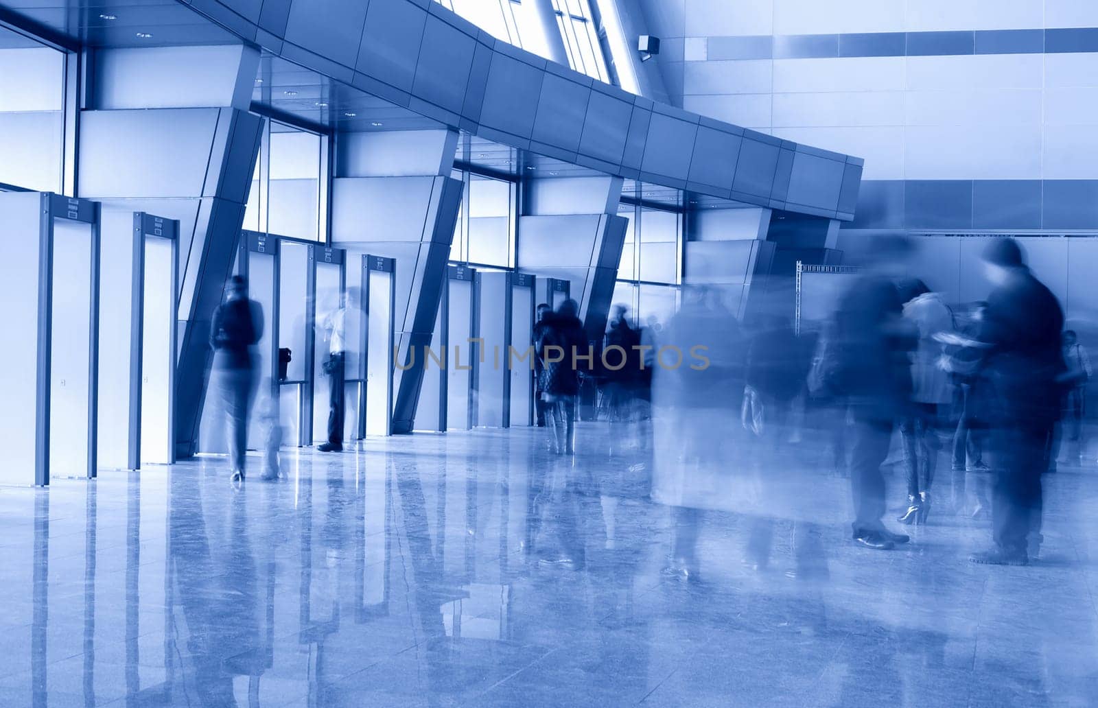 People in a modern architectural interior. Motion blur