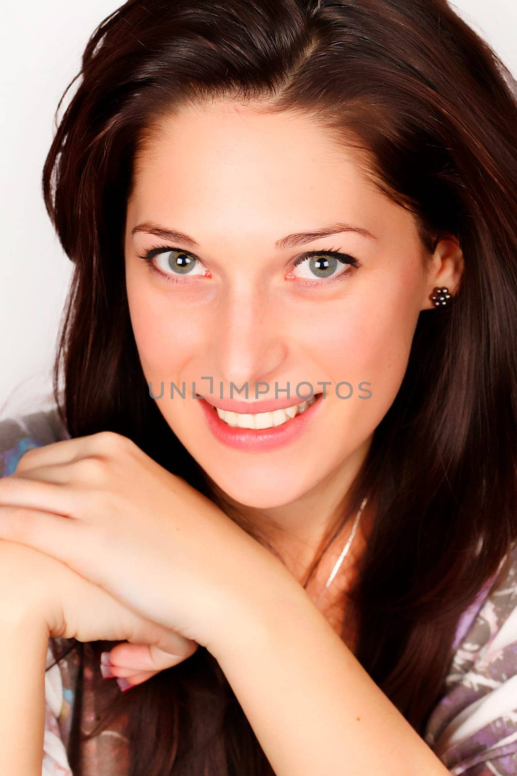 Portrait of a smiling young woman with black hair