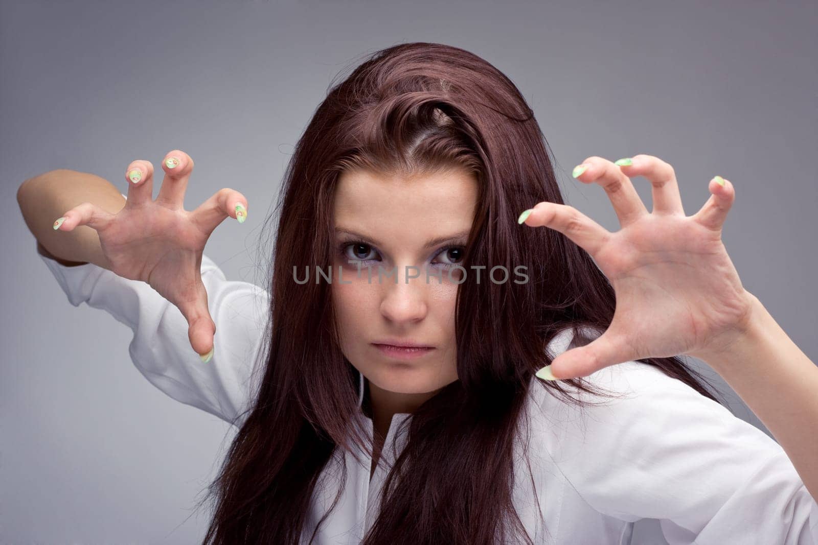 Portrait of a young aggressive woman