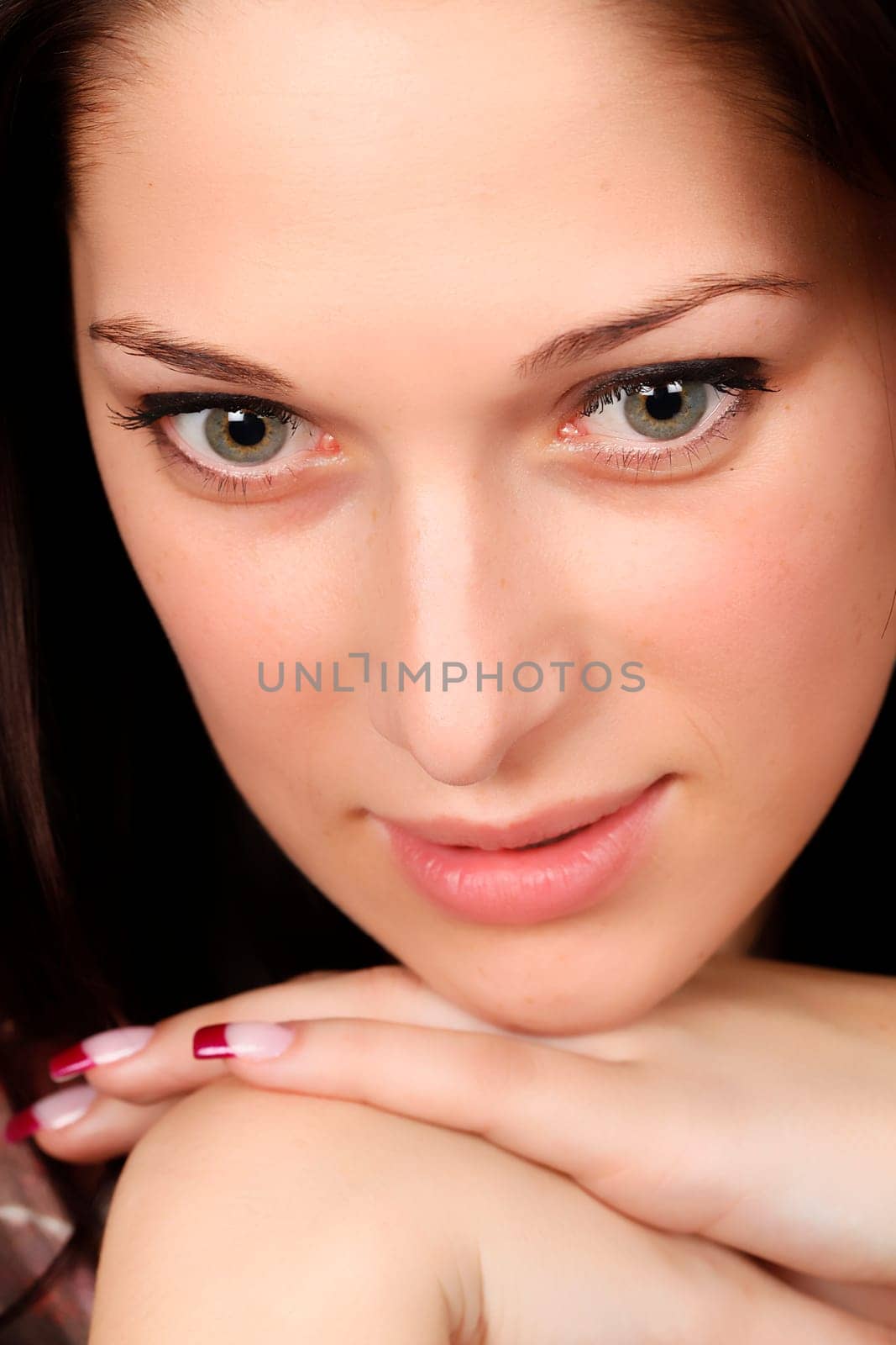 Portrait of a smiling young woman with black hair