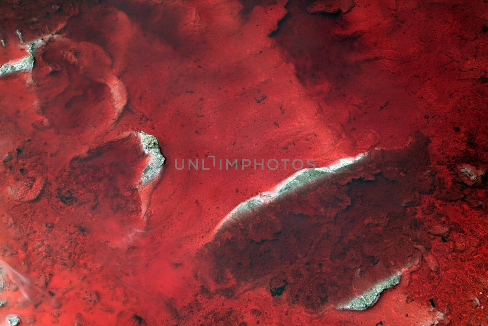 Abstract of a red diesal pollution spill.
