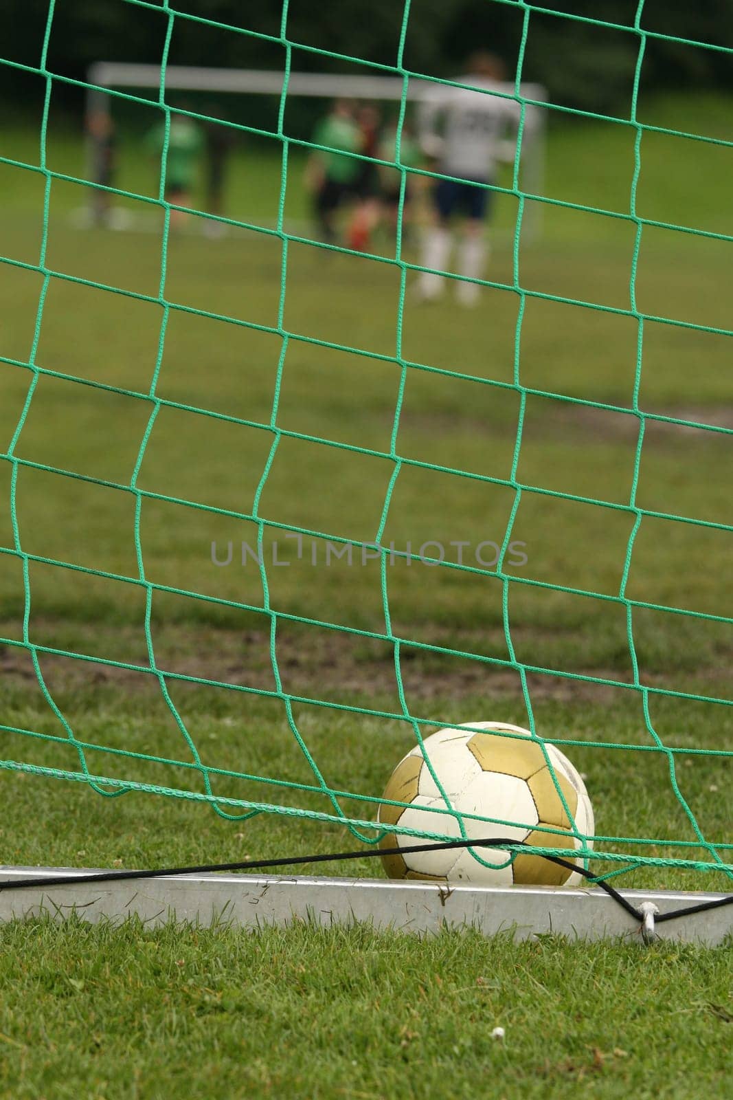 Photo of an soccer ball in a goal