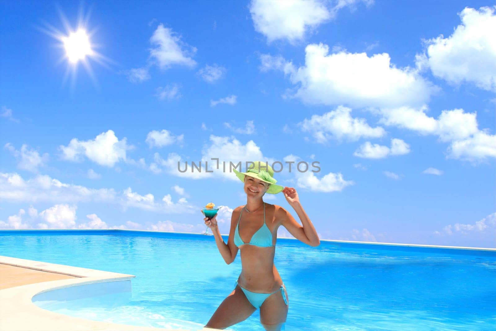 Pretty woman enjoying a swimming pool in Greece