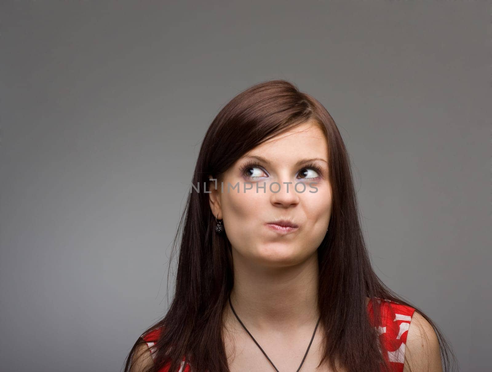 Closeup portrait of a thinking young woman