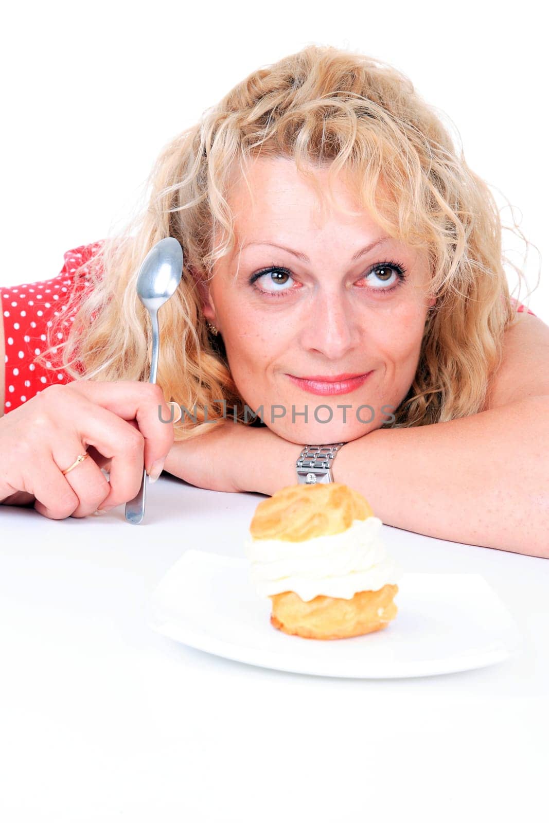 Hungry gluttonous woman eating cake